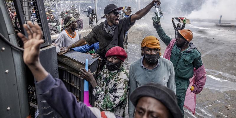 Protesters storm the fire-ravaged parliament building in Kenya's capital