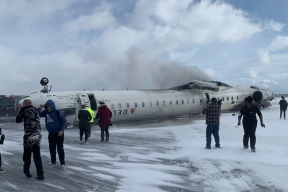 An airplane flipped over at Toronto airport, there are casualties